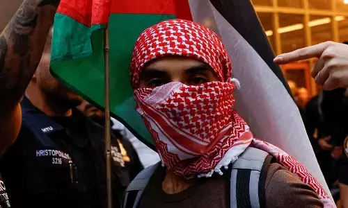 A Pro-Palestinian protester takes part in a rally against Israels strikes on Gaza and Lebanon, in New York City, US.