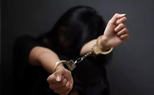 Photo of Woman hands in handcuffs Photo of Woman hands in handcuffs