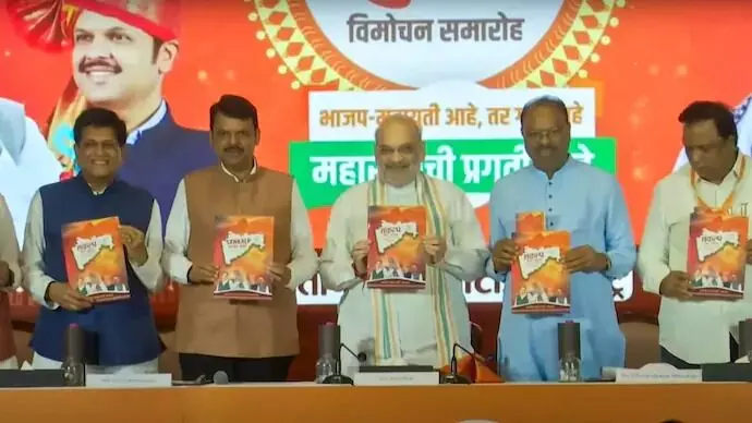 Photo of Amit Shah releasing BJP poll manifesto for Maharashtra