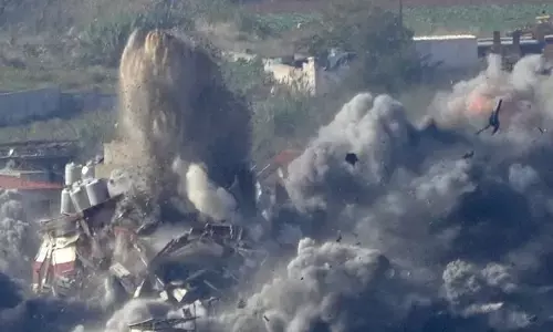 Photo of Smoke rises from a building hit in an Israeli airstrike in Dahiyeh, in the southern suburb of Beirut, Lebanon,