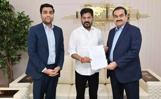 Photo of  Revanth Reddy, Gautham Adani