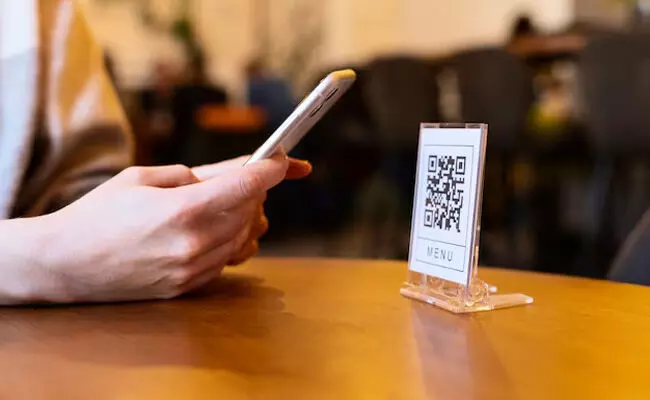 Person scanning qr code Person scanning qr code