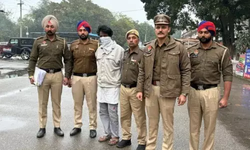 Photo of accused Ram Sarup, involved in 11 murder cases, being produced in a local court by police