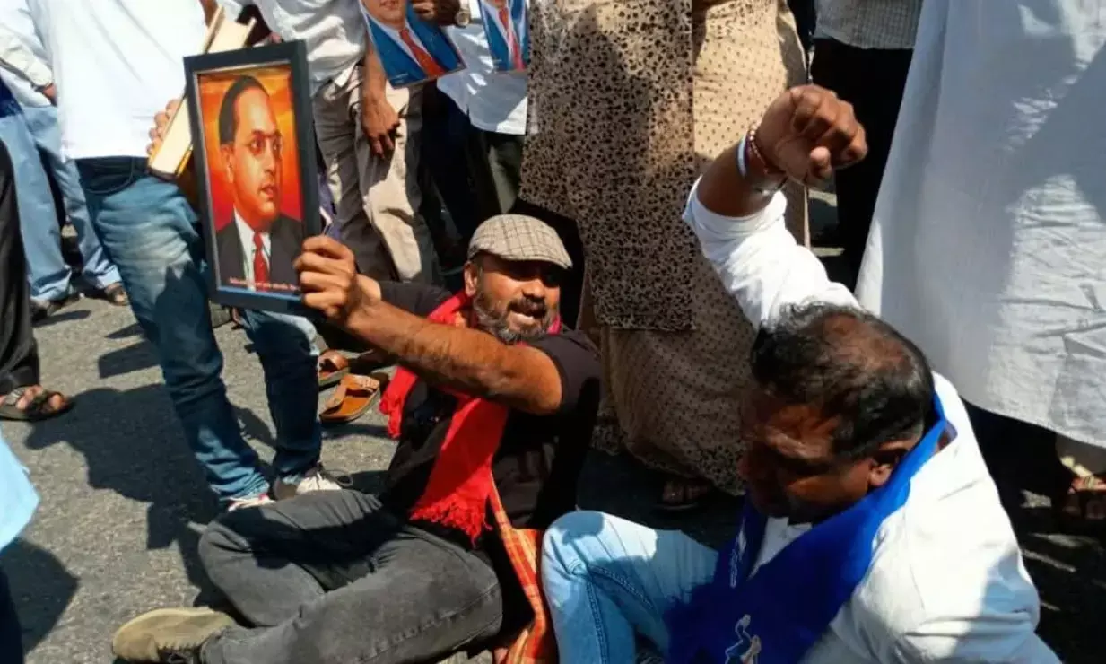 ಹಾಸನ | ಅಮಿತ್ ಶಾ ಹೇಳಿಕೆ ಖಂಡಿಸಿ ದಲಿತ ಸಂಘಟನೆಗಳಿಂದ ರಾಷ್ಟ್ರೀಯ ಹೆದ್ದಾರಿ ತಡೆ