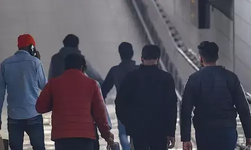 Represenatational image of people walking inside Airport