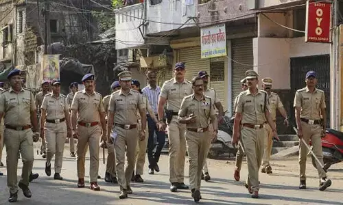 Nagpur Commissioner of Police Ravinder Singal with other police personnel reviews the law and order situation