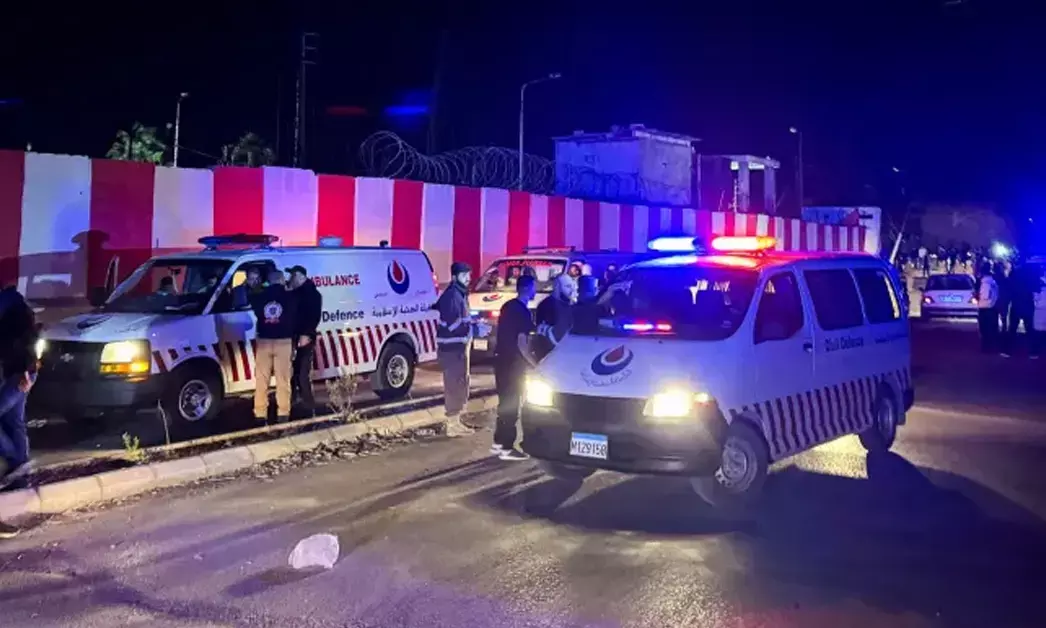 Civil defence vehicles park at the entrance of Ain al-Hilweh Palestinian refugee camp, following an Israeli attack