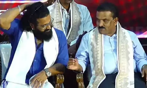 Actor Rishab Shetty with K. V. Prabhakar at the felicitation ceremony of Pambada.