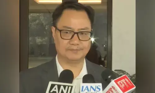 Kiren Rijiju speaking to reporters