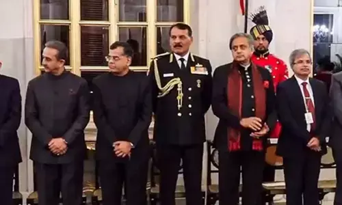 Chief of the Naval Staff Admiral Dinesh Kumar Tripathi, Congress MP Shashi Tharoor and other dignitaries during a state banquet at Rashtrapati Bhavan.