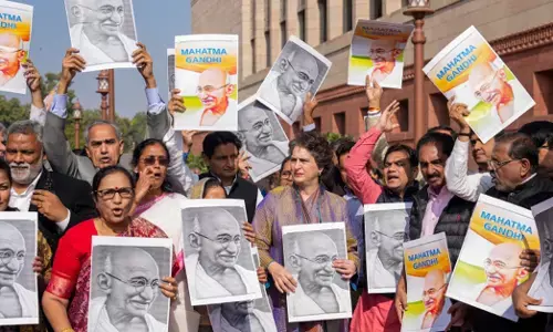 Congress MP Priyanka Gandhi Vadra and other opposition MPs participate in a protest march against the VB-G RAM G Bill, introduced by the union government to replace the Mahatma Gandhi National Rural Employment Guarantee Act (MGNREGA), 2005, during the Winter session of Parliament, in New Delhi
