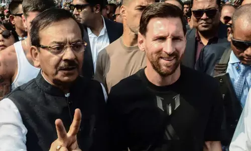 Argentine footballer Lionel Messi with West Bengal Minister for Sports and Youth Affairs Aroop Biswas at Salt Lake Stadium during his G.O.A.T India Tour 2025, in Kolkata on December 13, 2025.