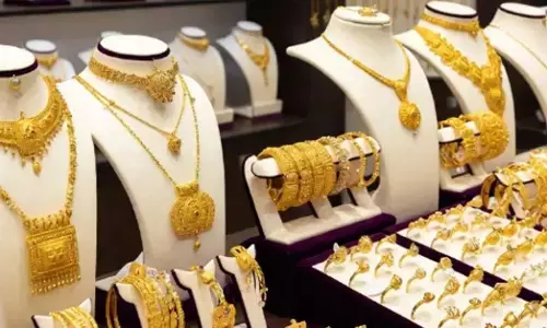 gold ornaments displayed in jewellery shop