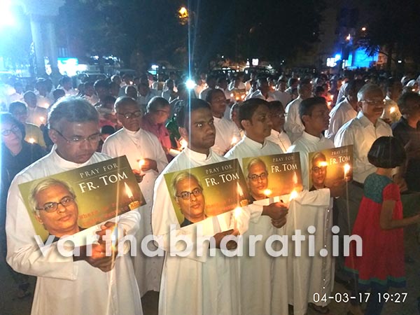 At candle-light march for abducted priest: Archbishop presses for government intervention