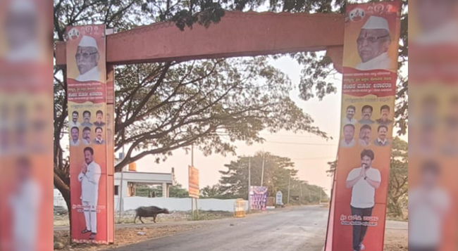 ಸಿಎಂ ಬೊಮ್ಮಾಯಿ ಕಾರ್ಯಕ್ರಮದ ಸ್ವಾಗತ ಕಮಾನಿನಲ್ಲಿ PSI ಹಗರಣದ ಆರೋಪಿಗಳ ಚಿತ್ರ!